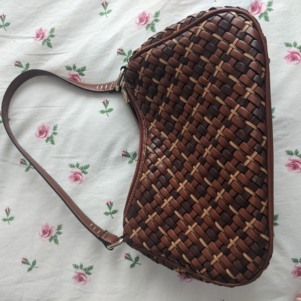 Genuine leather, wicker style bag.